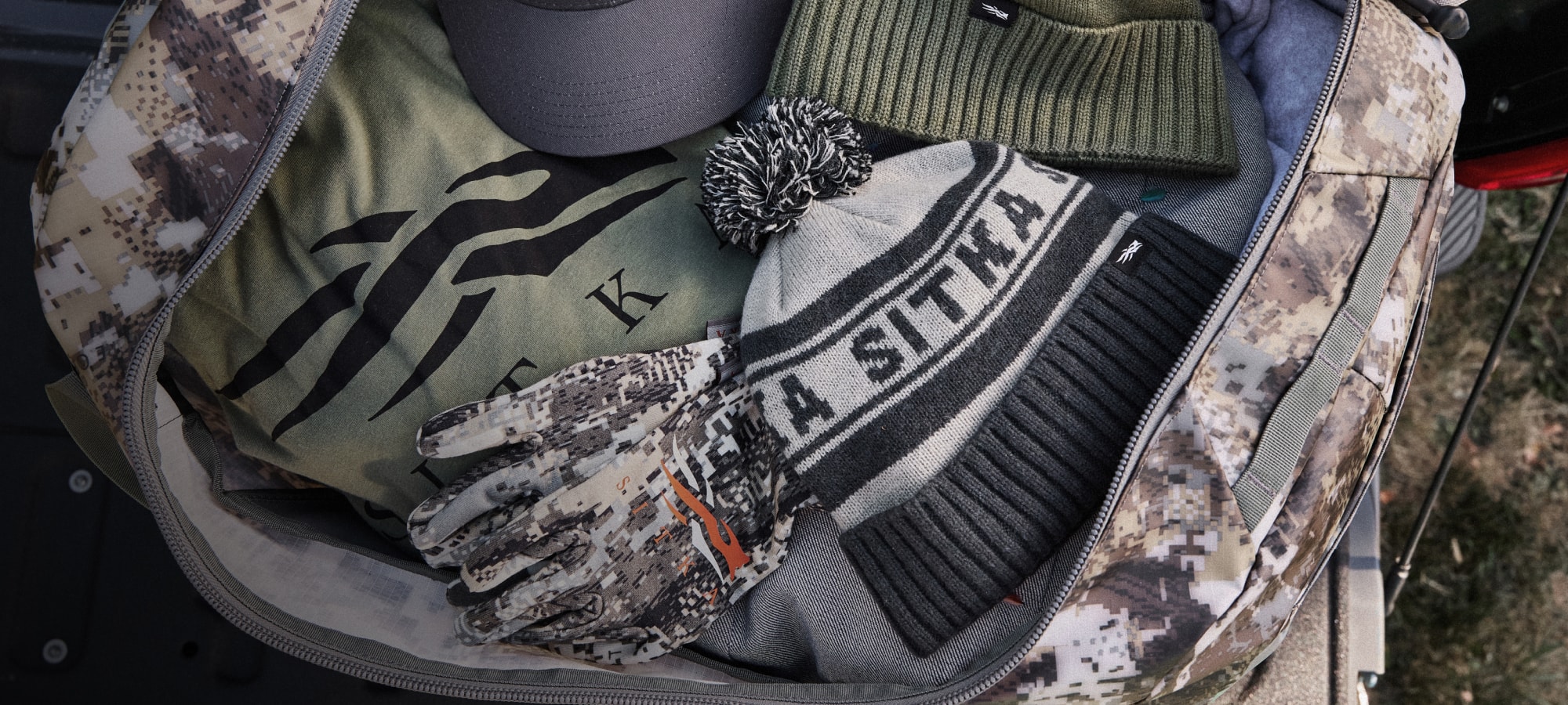 SITKA Tees, Hats, and Gloves in a Drifter Duffle 50L in Optifade Elevated II | SITKA Gear Holiday Gift Guide