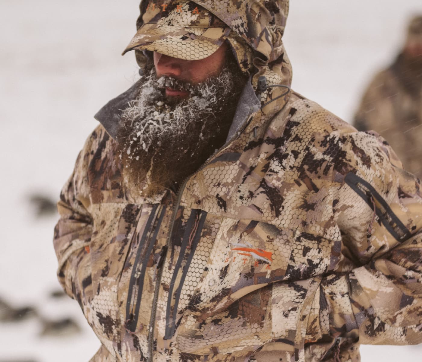 Man in the Boreal Aerolite Jacket in Optifade Marsh braving the cold | SITKA Gear Holiday Gift Guide