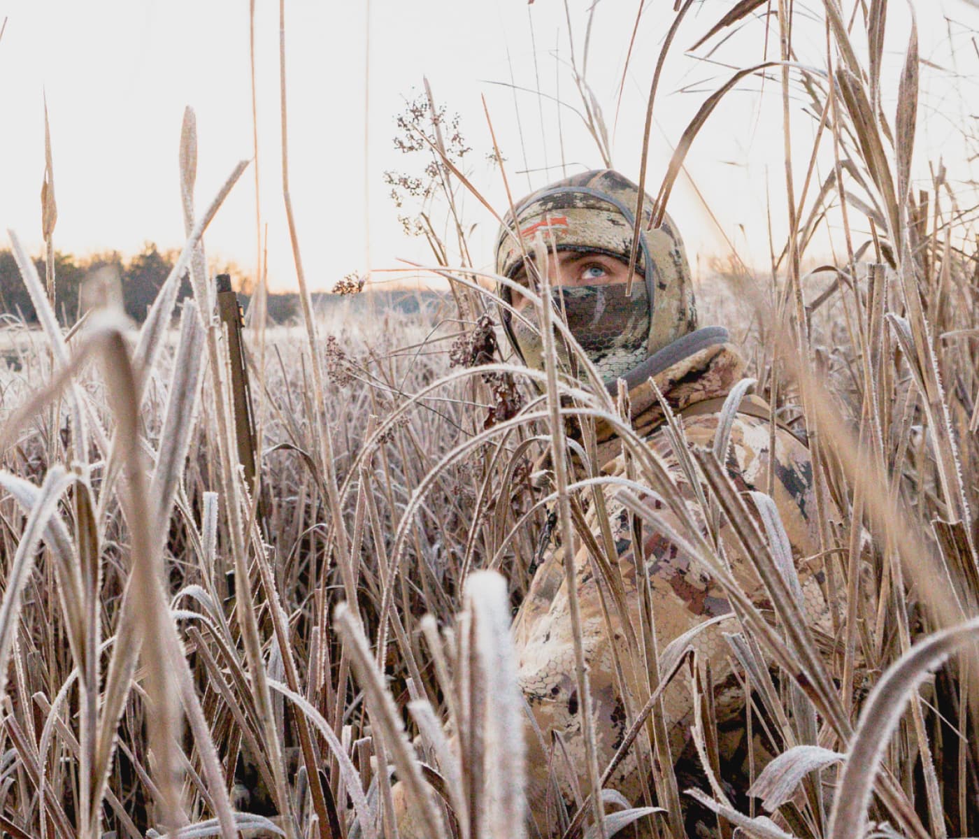 Man looking to the sky in search of ducks | SITKA Gear